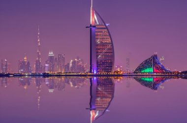 Captivating night scene showcasing Burj Al Arab and Dubai skyline reflections by Prime Tourism